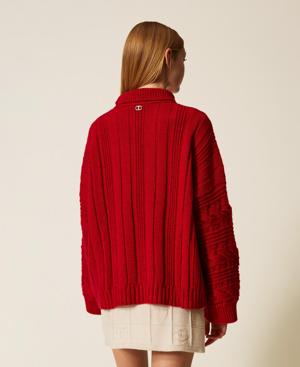 Maxi pull en laine m&eacute;lang&eacute;e avec torsades