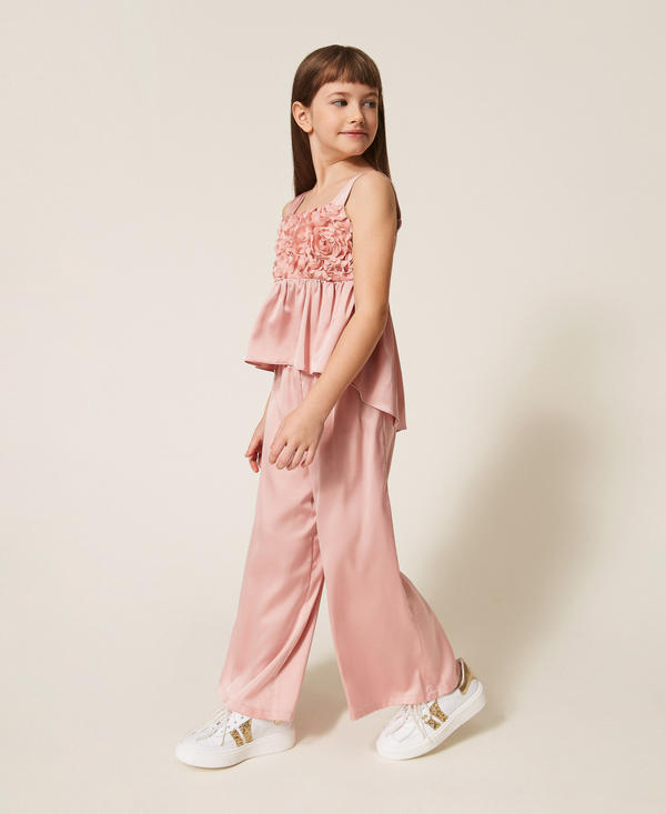 Top with roses and satin trousers