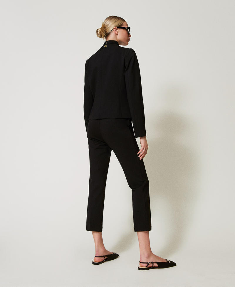 Trousers with jewel buttons