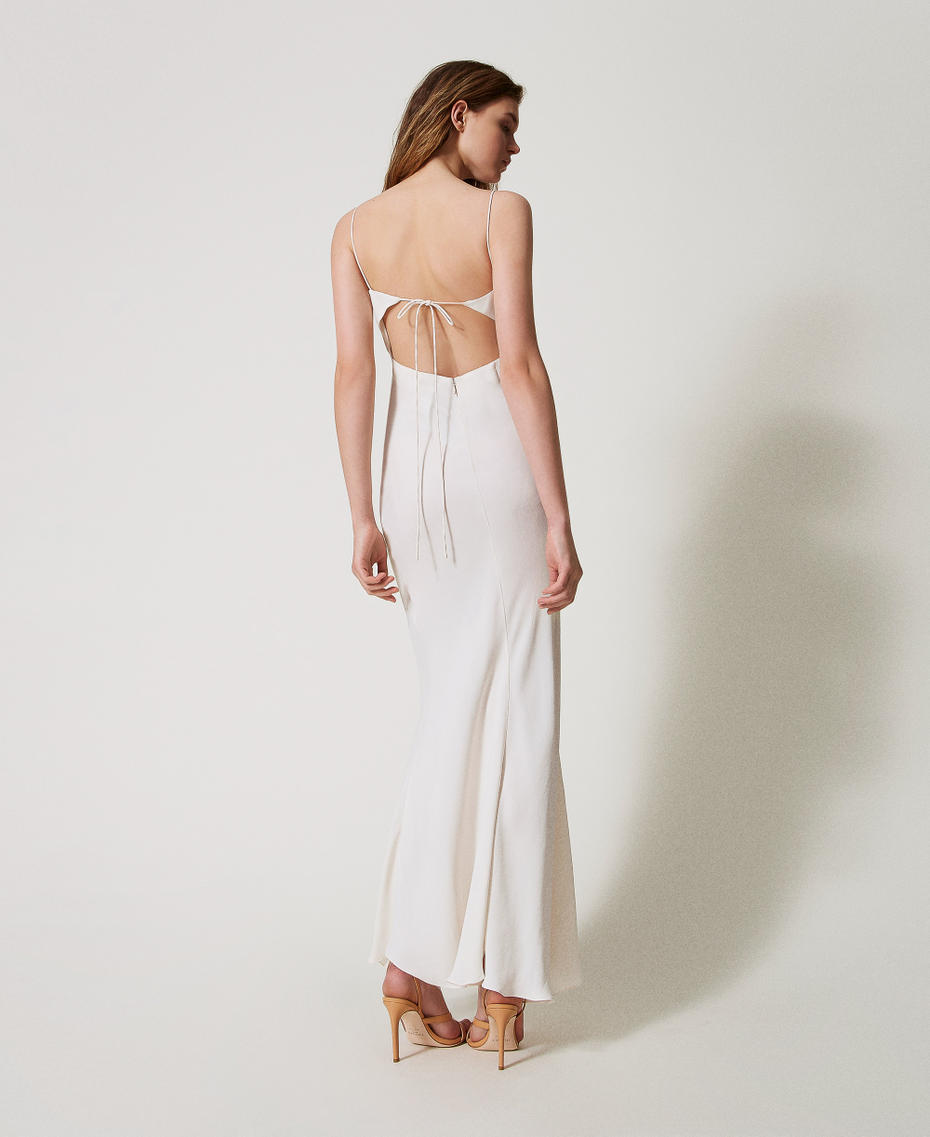 Long slip dress with an embroidered butterfly
