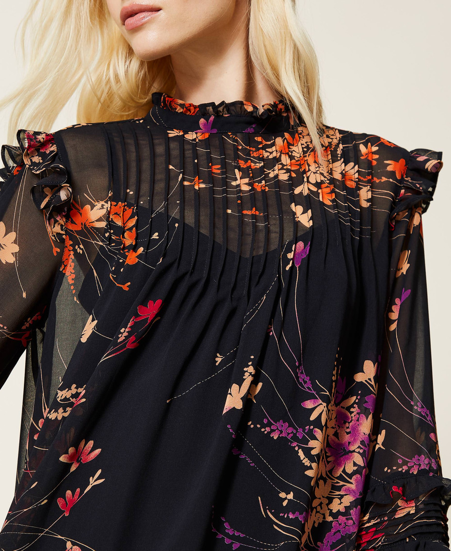 Blusa con volants sulle maniche