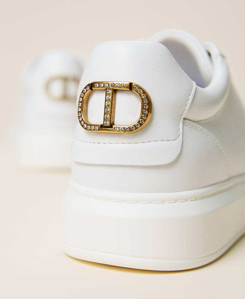 Leather trainers with rhinestone logo