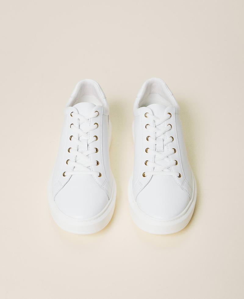 Leather trainers with rhinestone logo