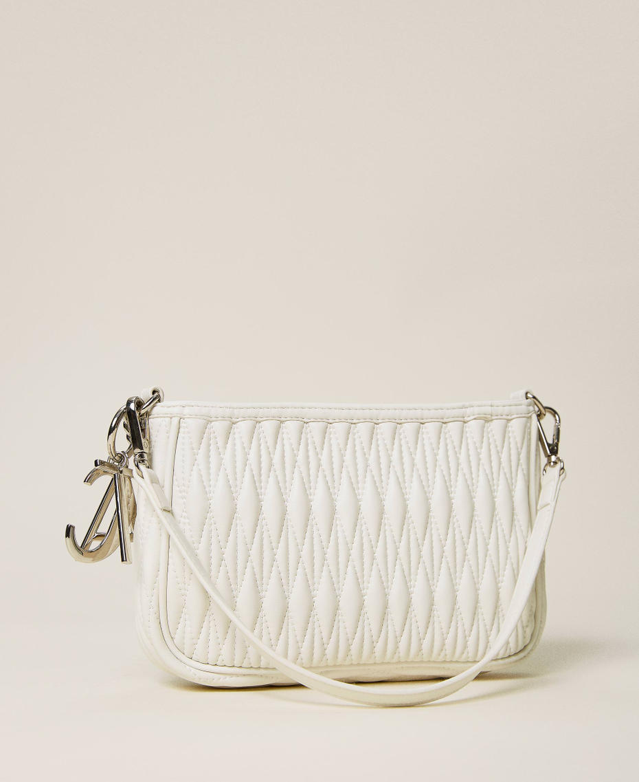 Quilted bag with chain and charms