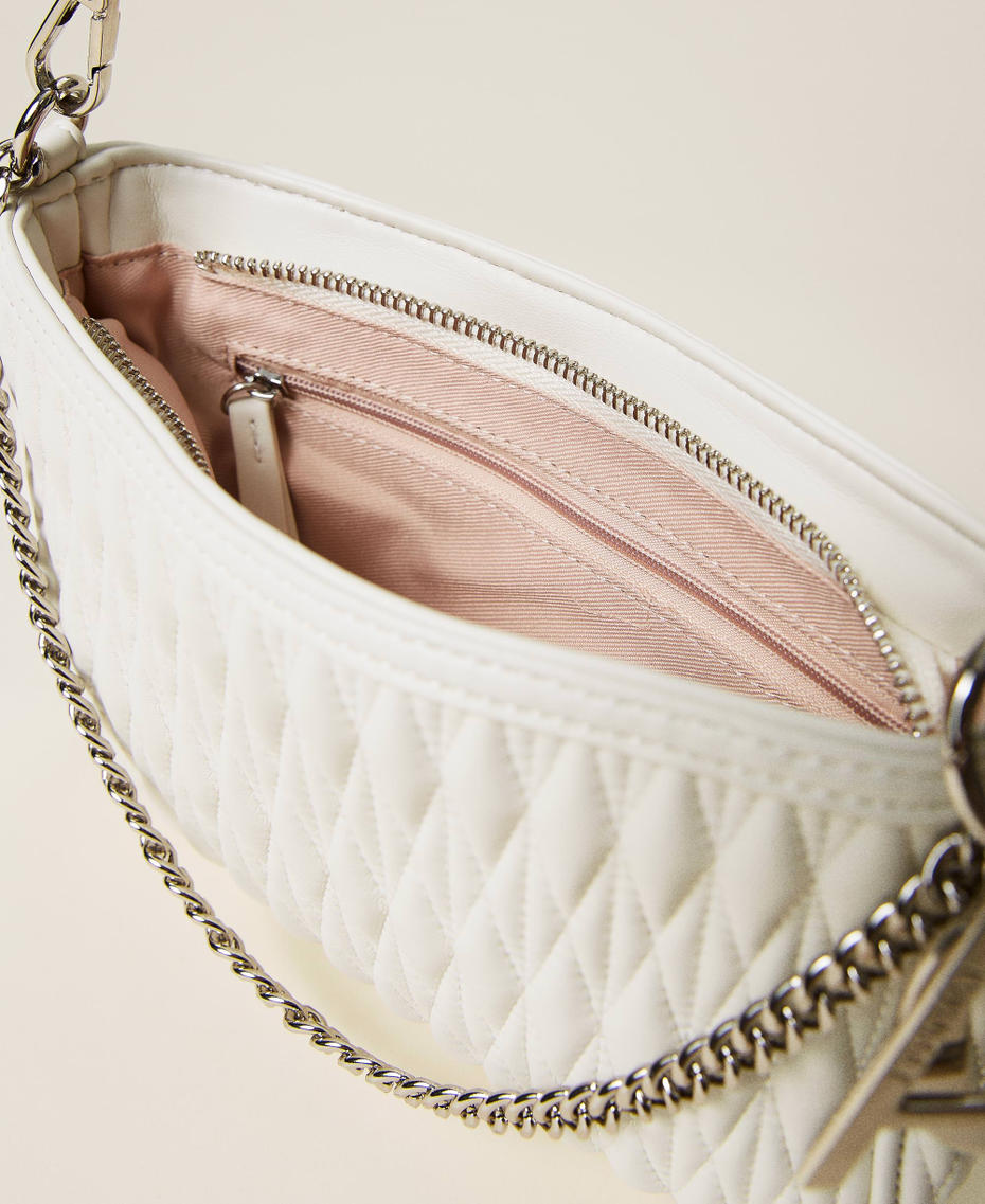 Quilted bag with chain and charms