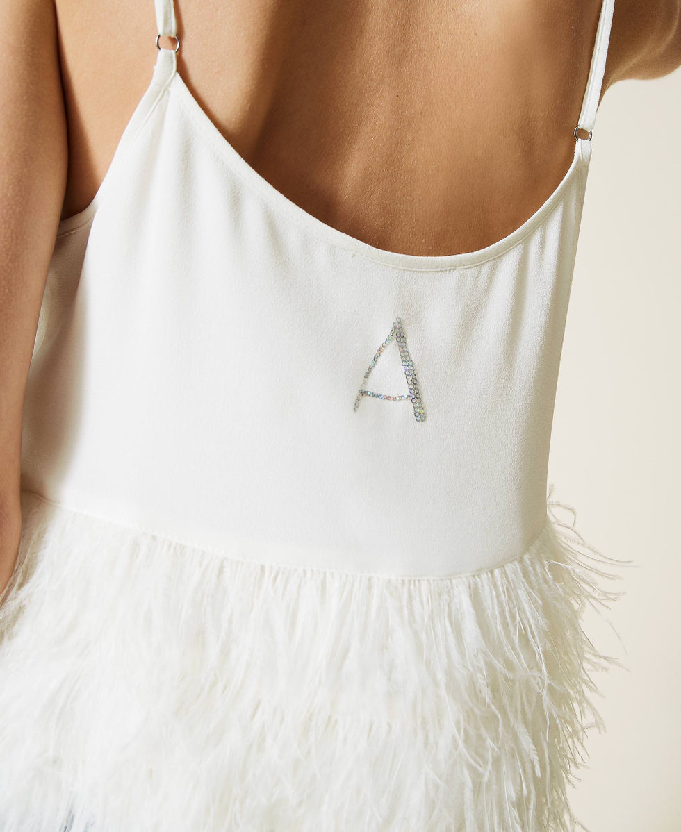 Satin top with feathers and logo
