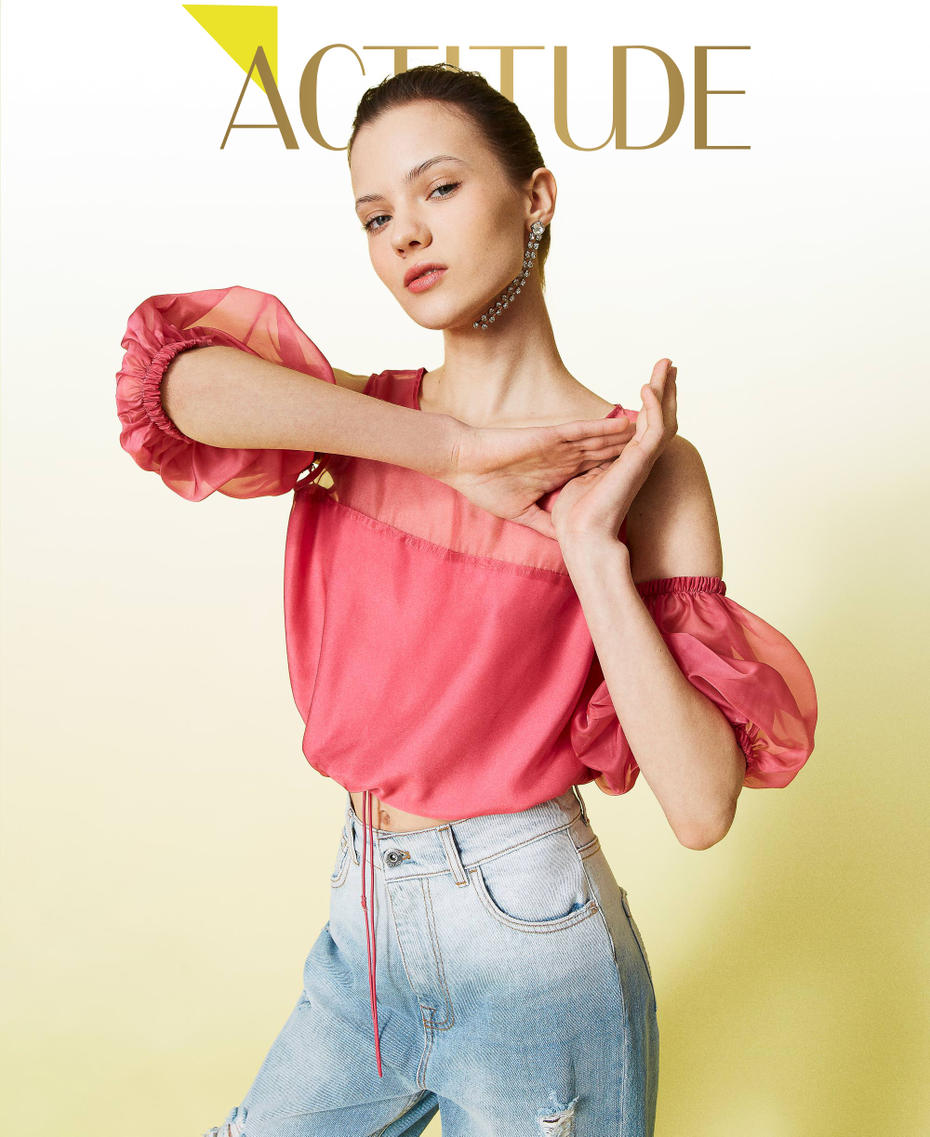 Organza top with removable sleeves.