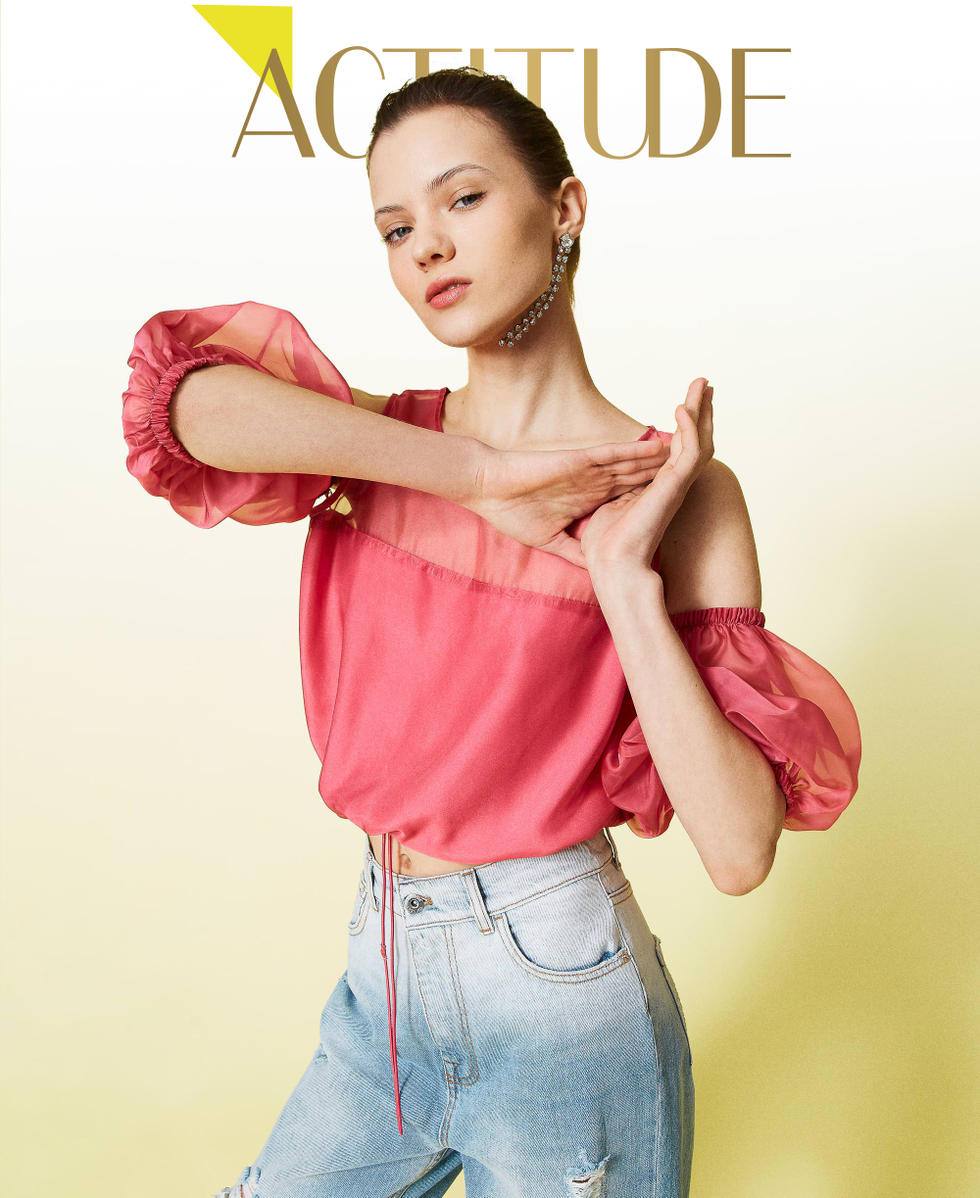 Organza top with removable sleeves.