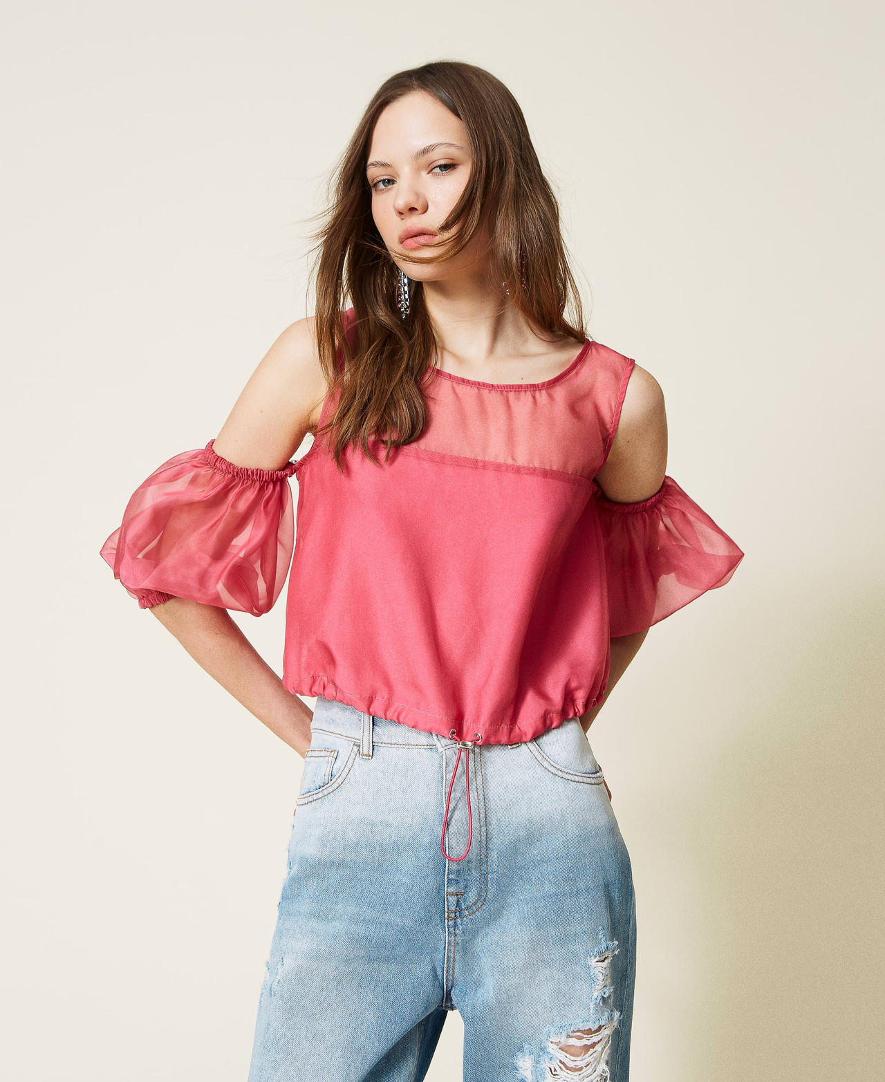 Organza top with removable sleeves.