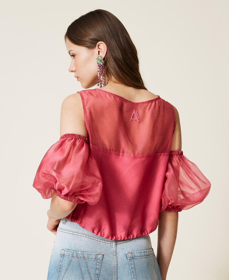Organza top with removable sleeves.