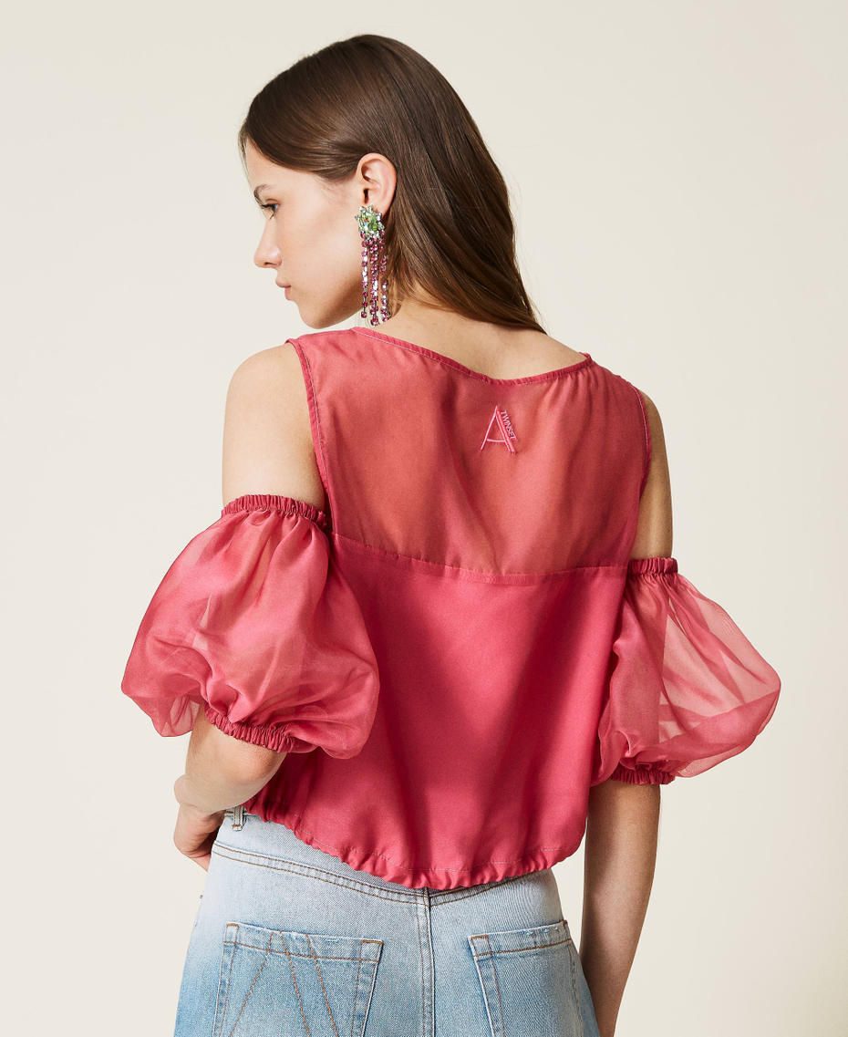 Organza top with removable sleeves.
