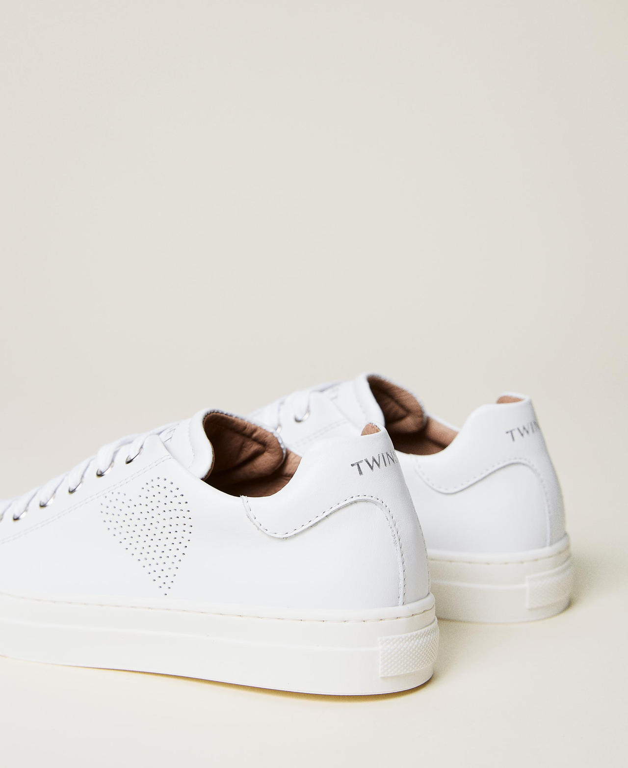 Leather trainers with openwork heart