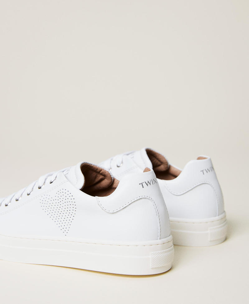 Leather trainers with openwork heart