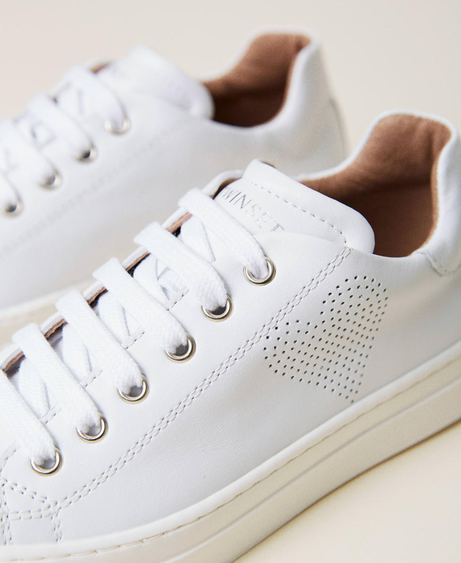 Leather trainers with openwork heart