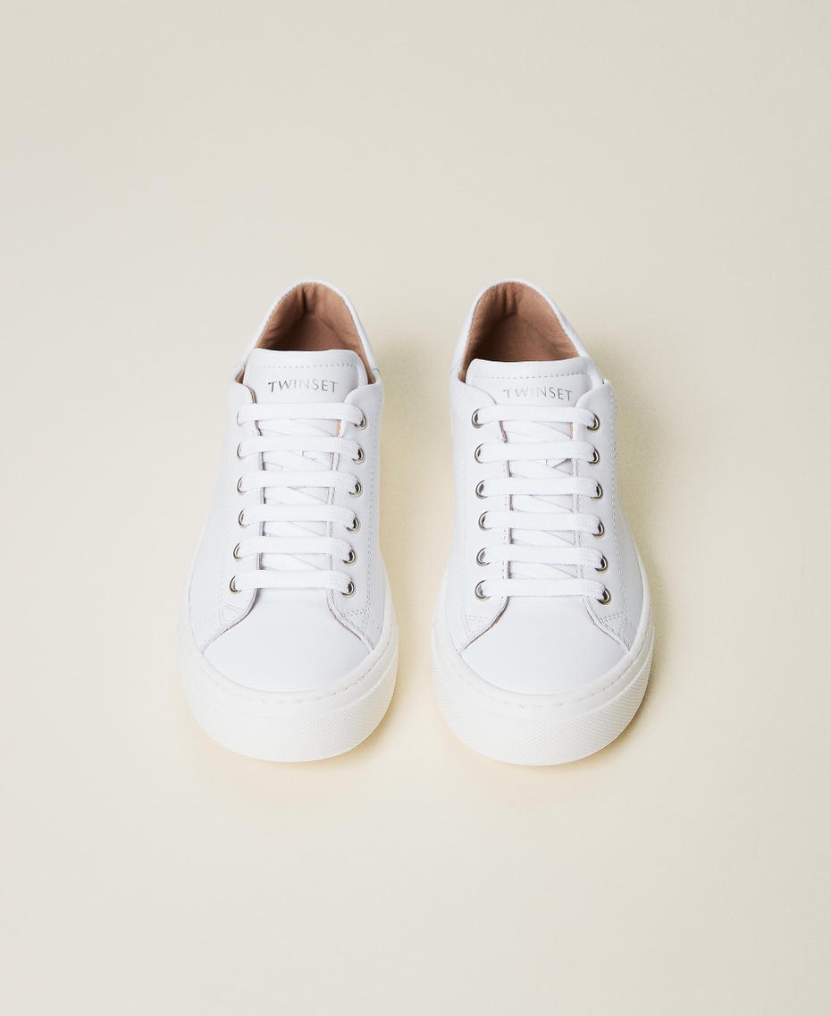 Leather trainers with openwork heart