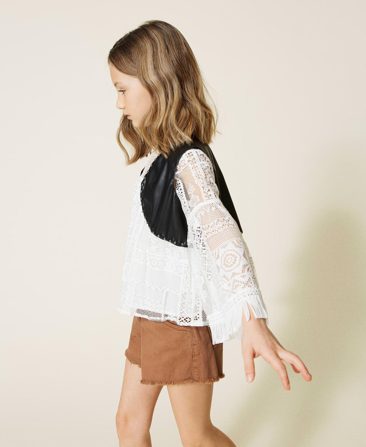 Coated fabric waistcoat with studs