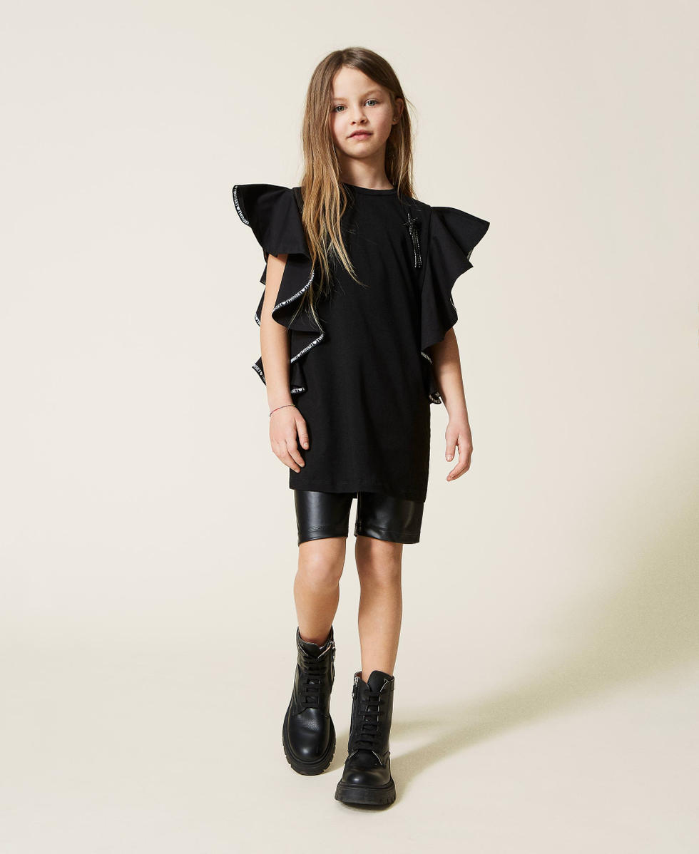 Ruffled t shirt and coated fabric cycling shorts