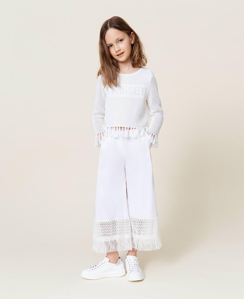 Pantaloni con pizzo e frange