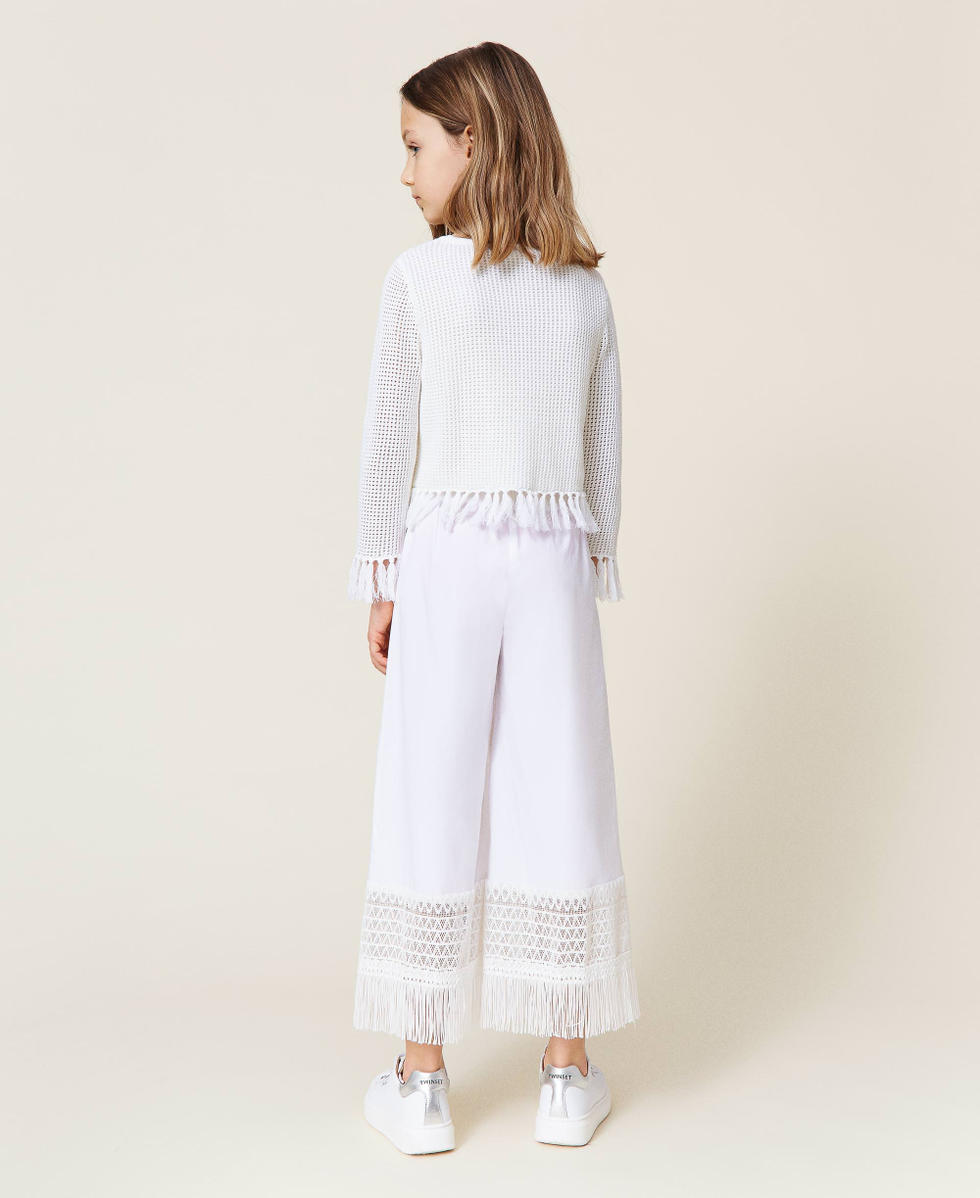 Pantaloni con pizzo e frange