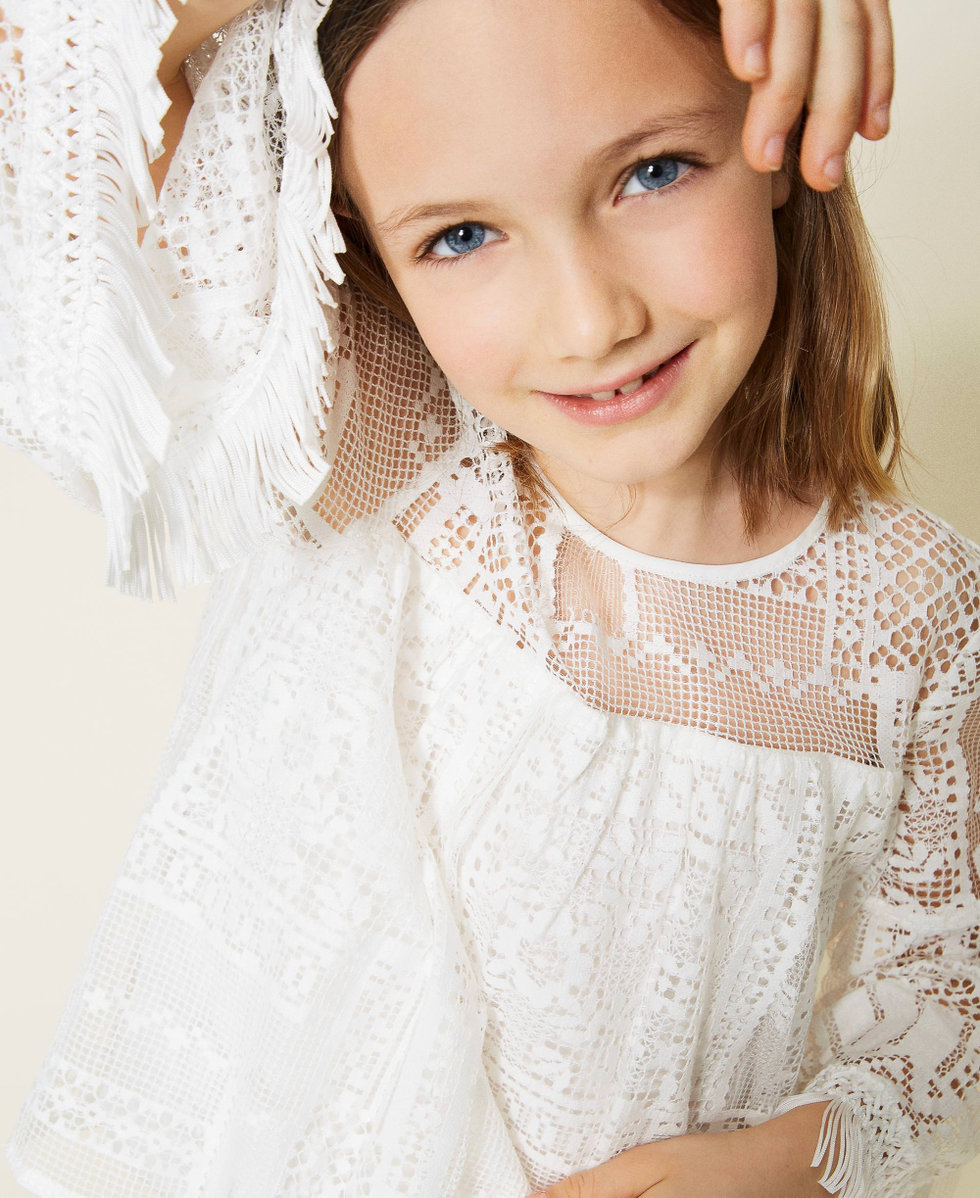 Lace blouse with fringes