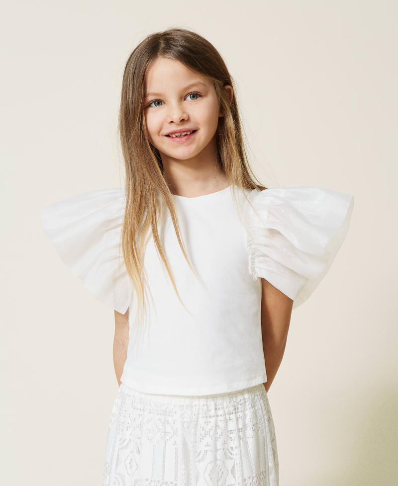 Top with organza sleeves