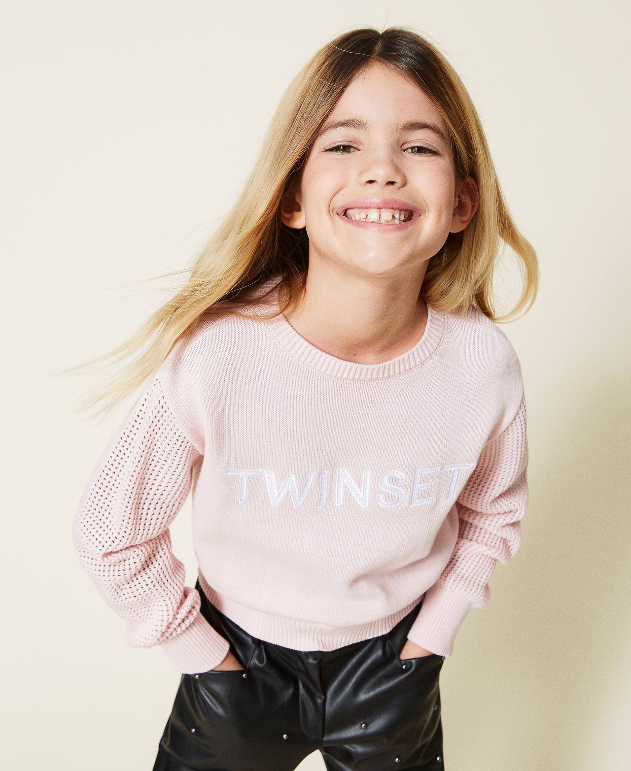 Jumper with openwork sleeves