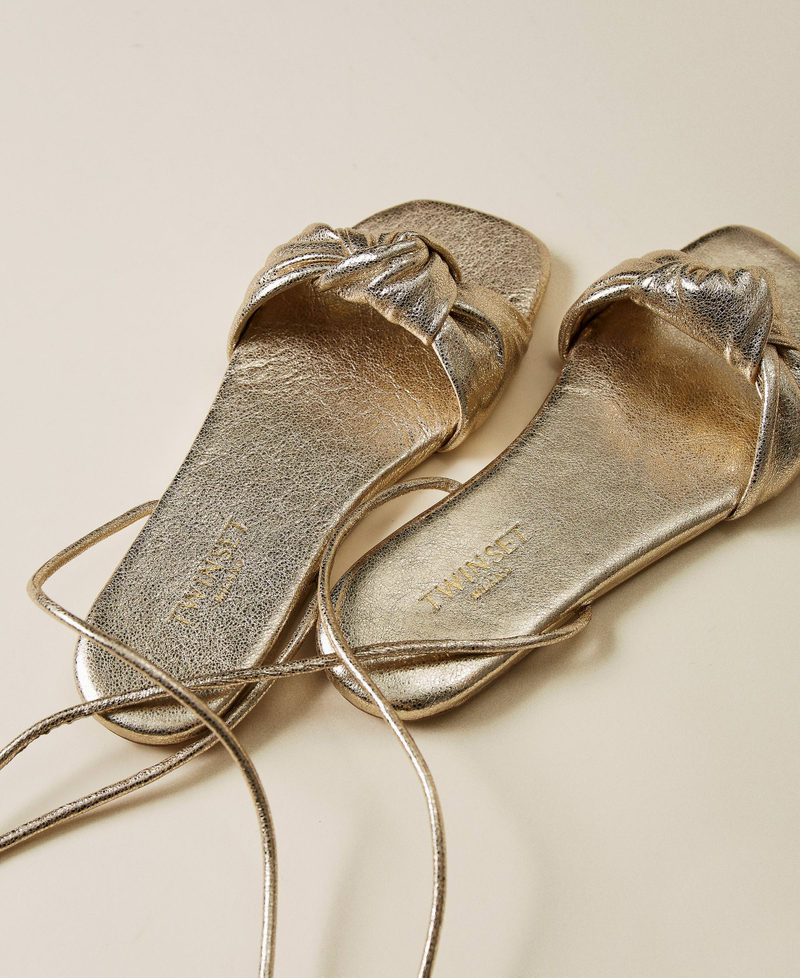 Laminated leather sandals with knot