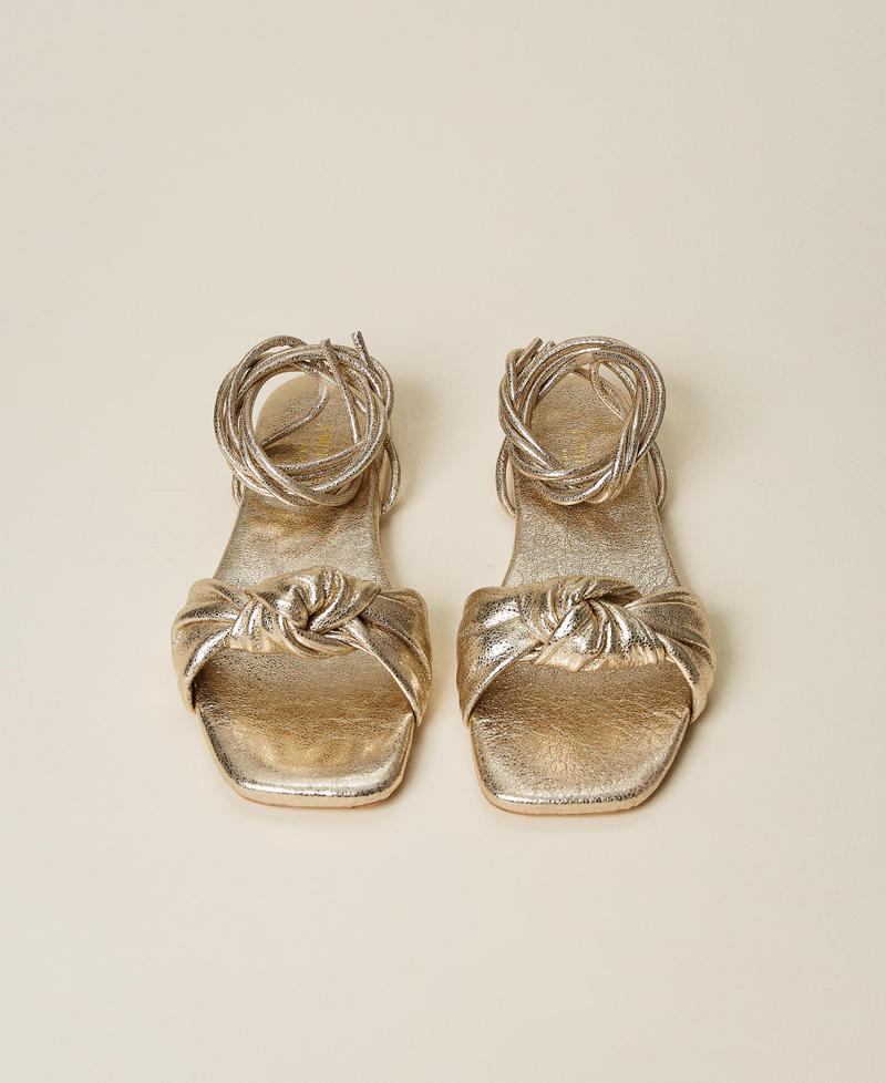 Laminated leather sandals with knot
