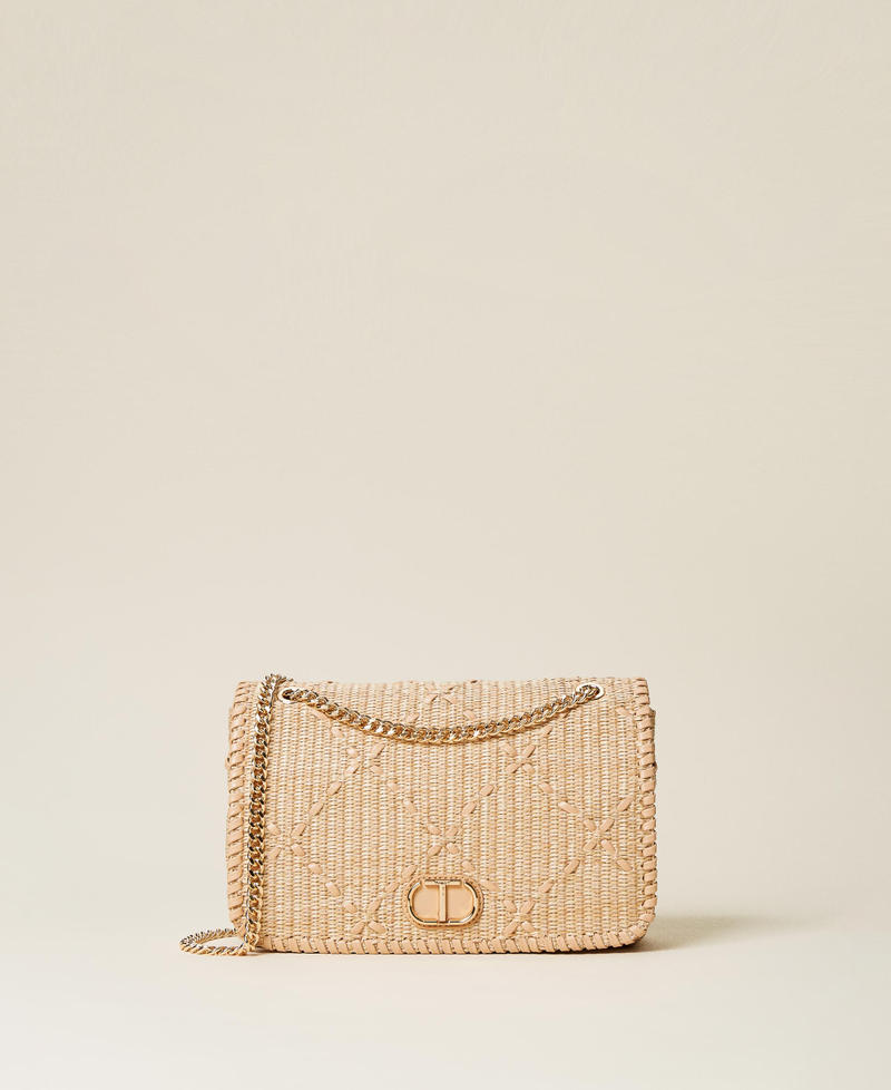 Bag with weaved raffia-like flap