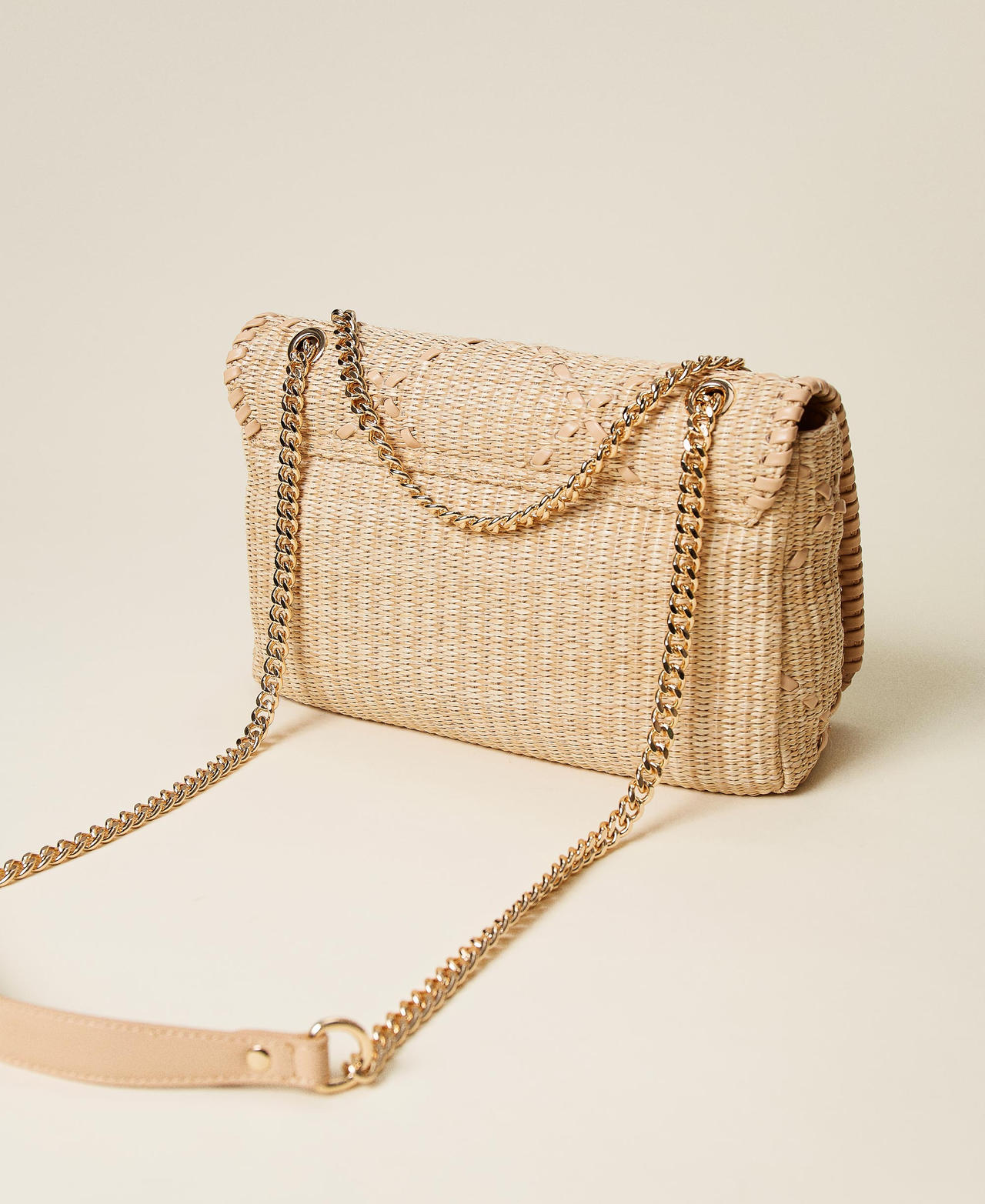 Bag with weaved raffia-like flap