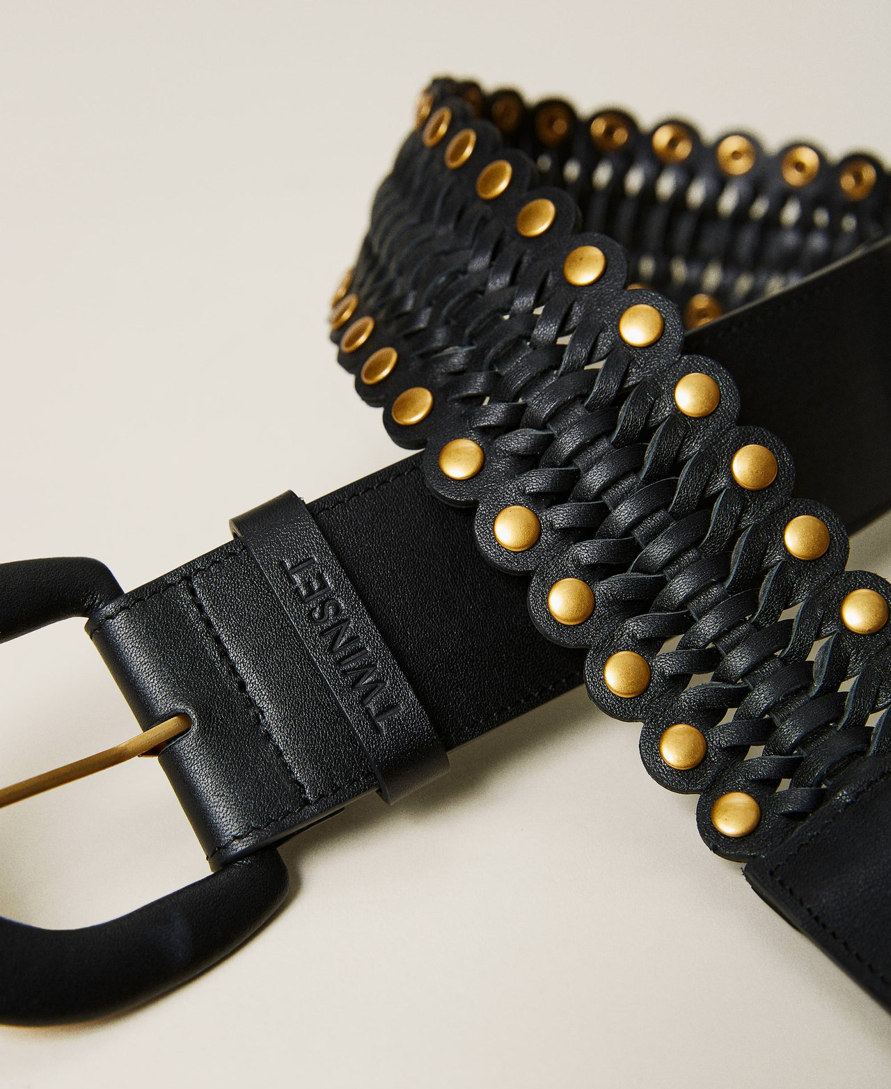 Leather belt with weaving and studs