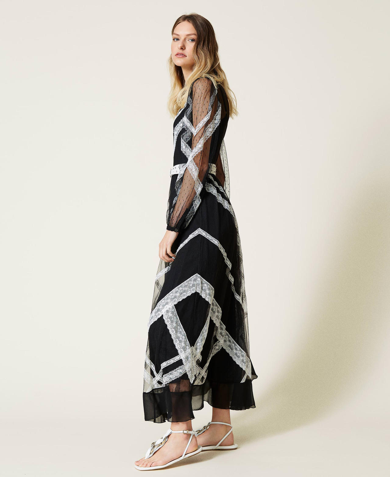 Long dress made of point d'esprit tulle and lace