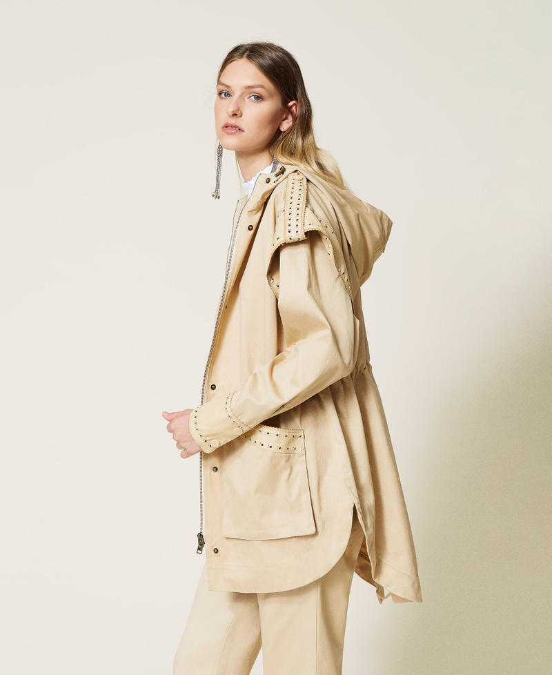 Parka coat with openwork embroidery