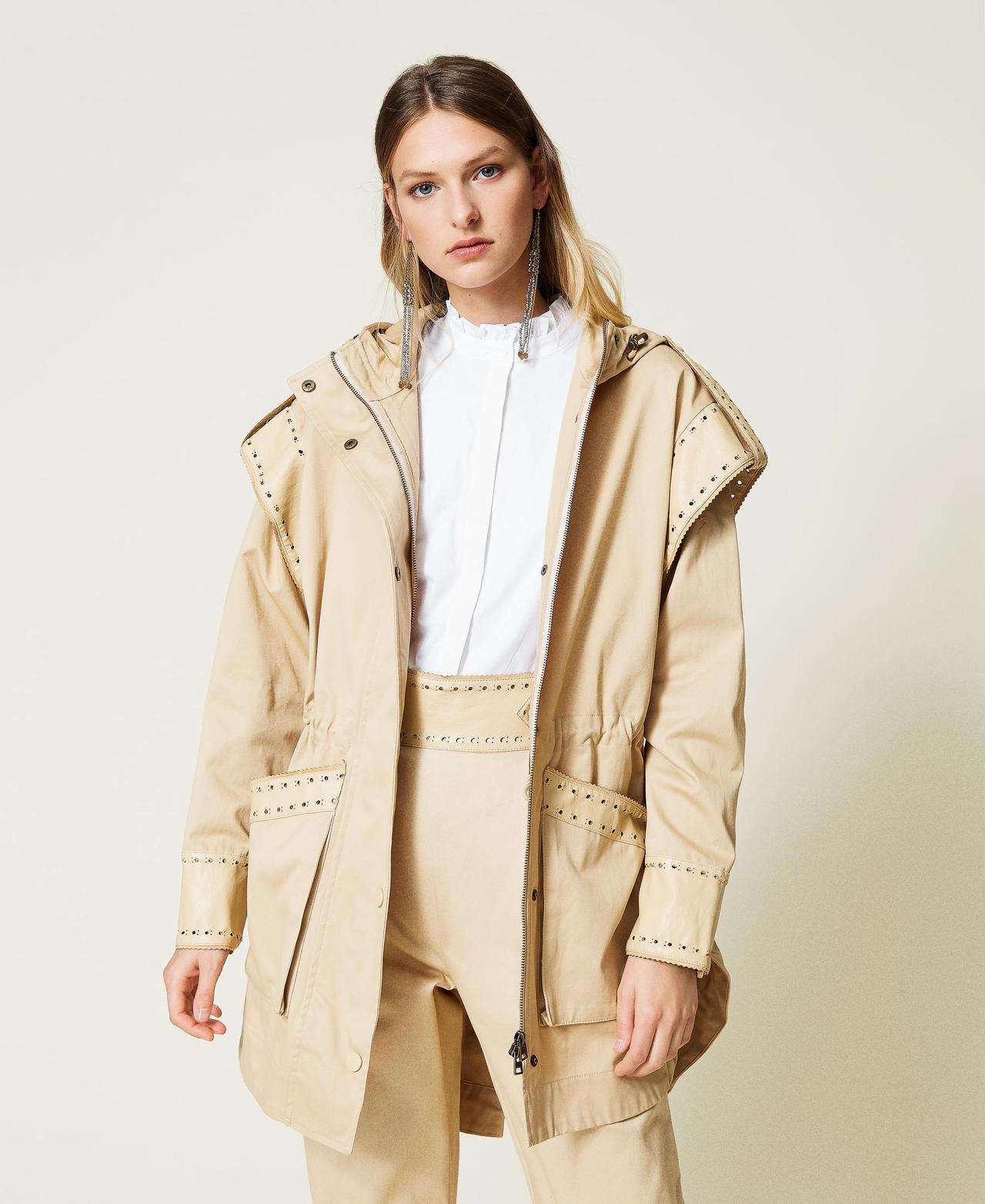 Parka coat with openwork embroidery