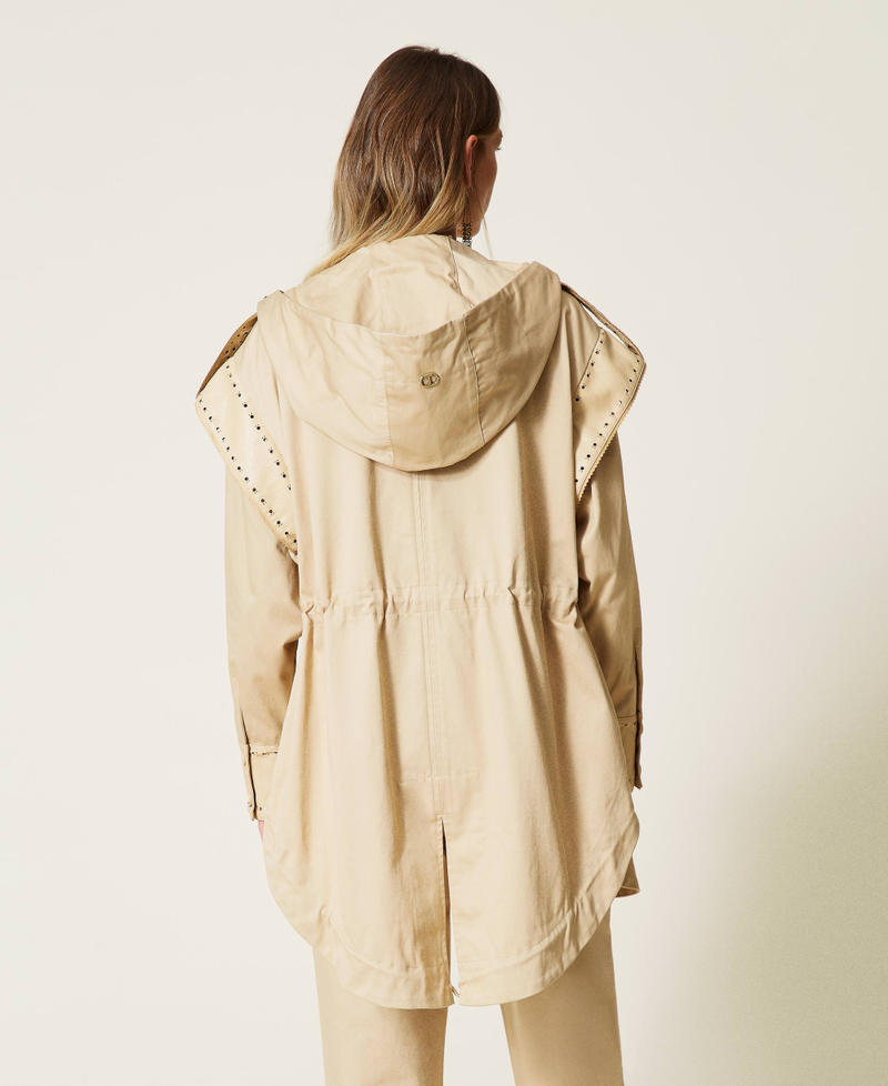 Parka coat with openwork embroidery