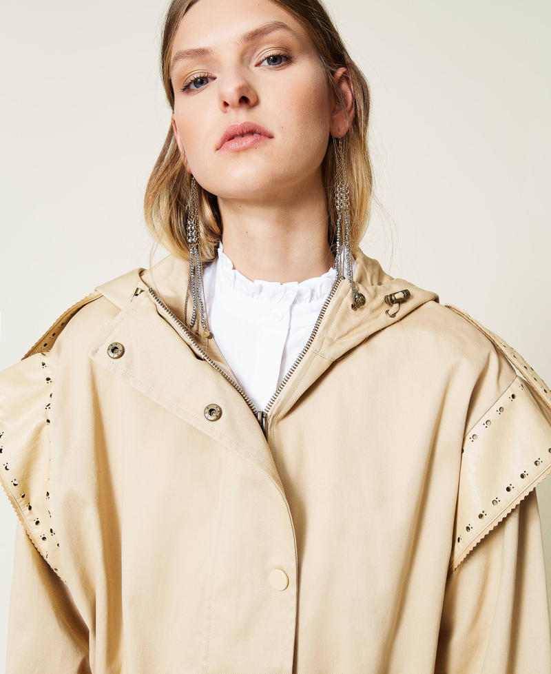 Parka coat with openwork embroidery