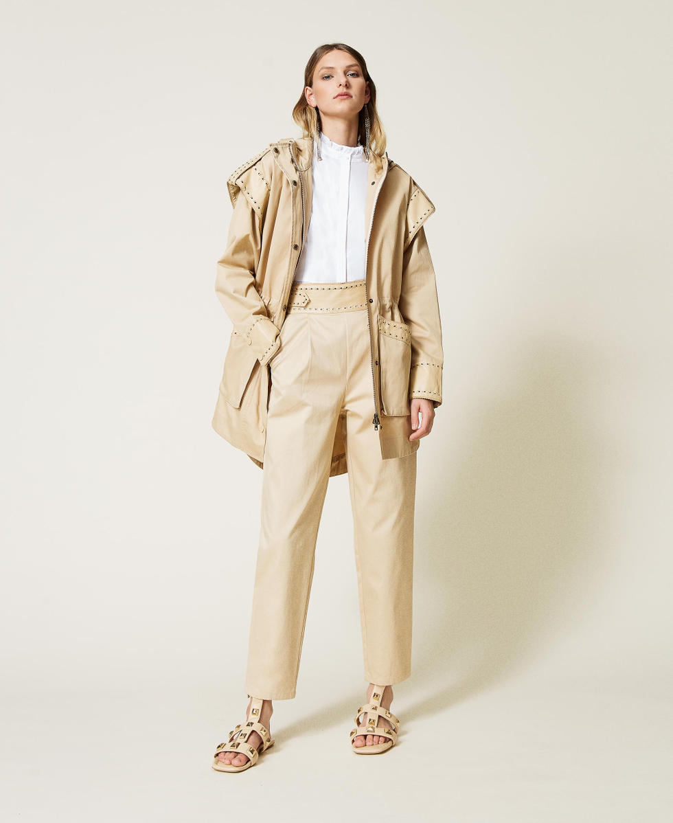 Parka coat with openwork embroidery