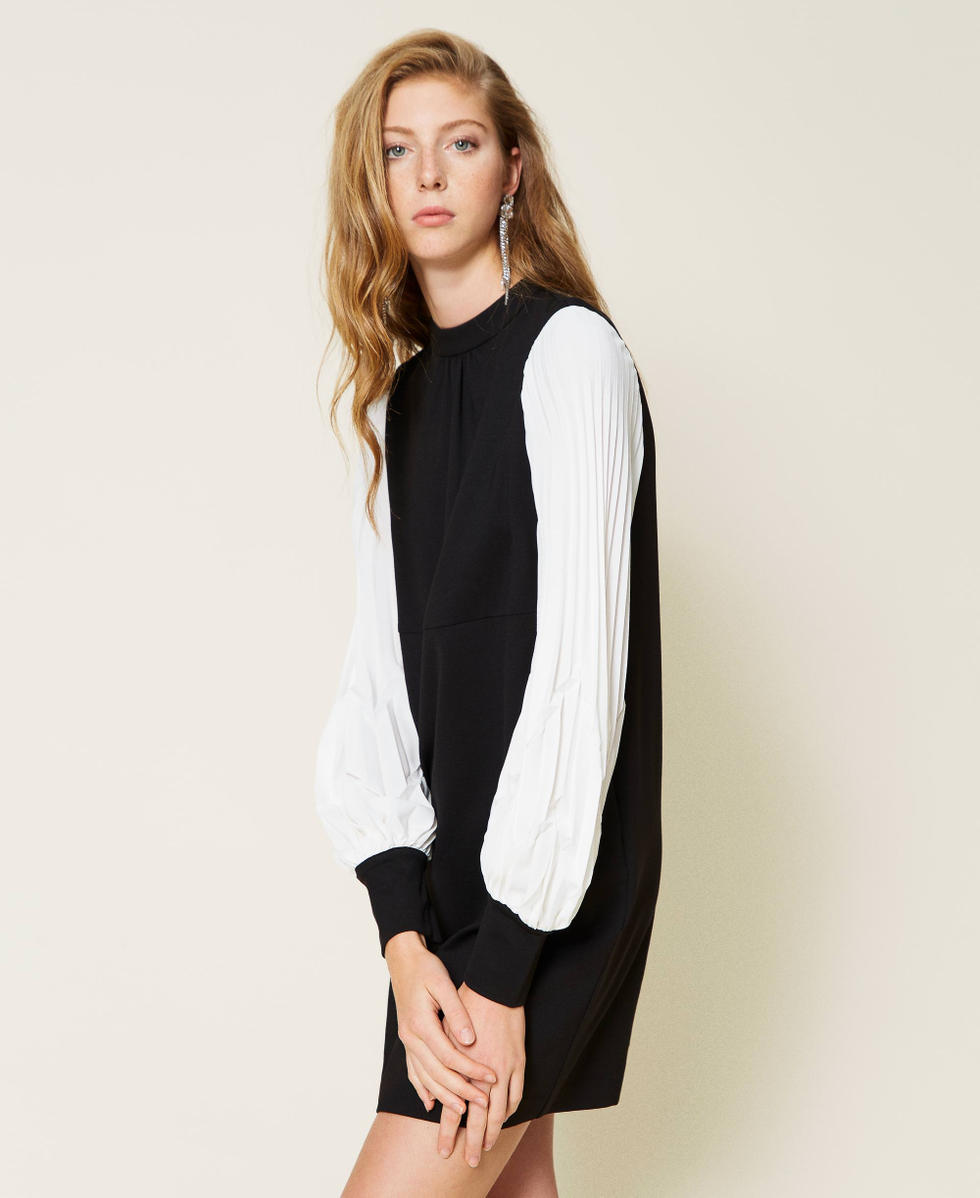 Dress with pleated sleeves