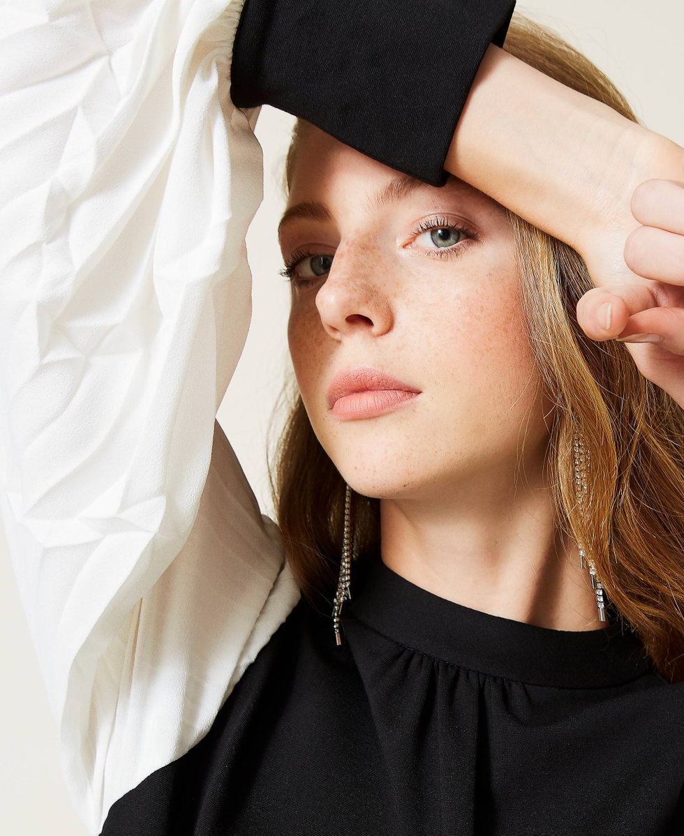 Dress with pleated sleeves