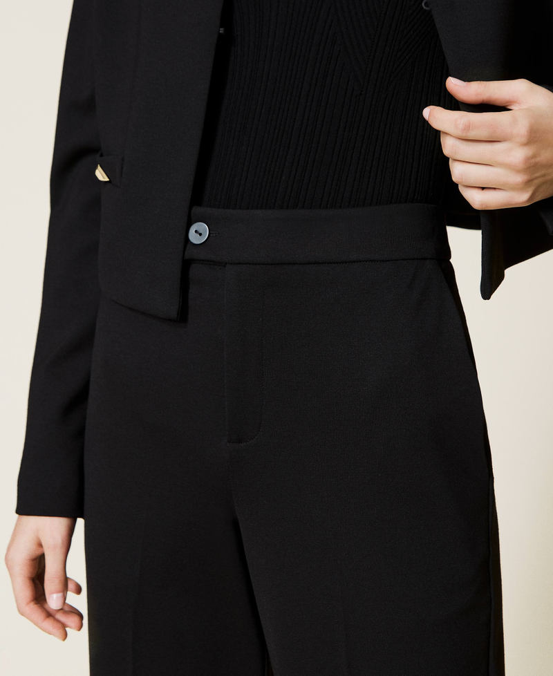 Cropped trousers with studs