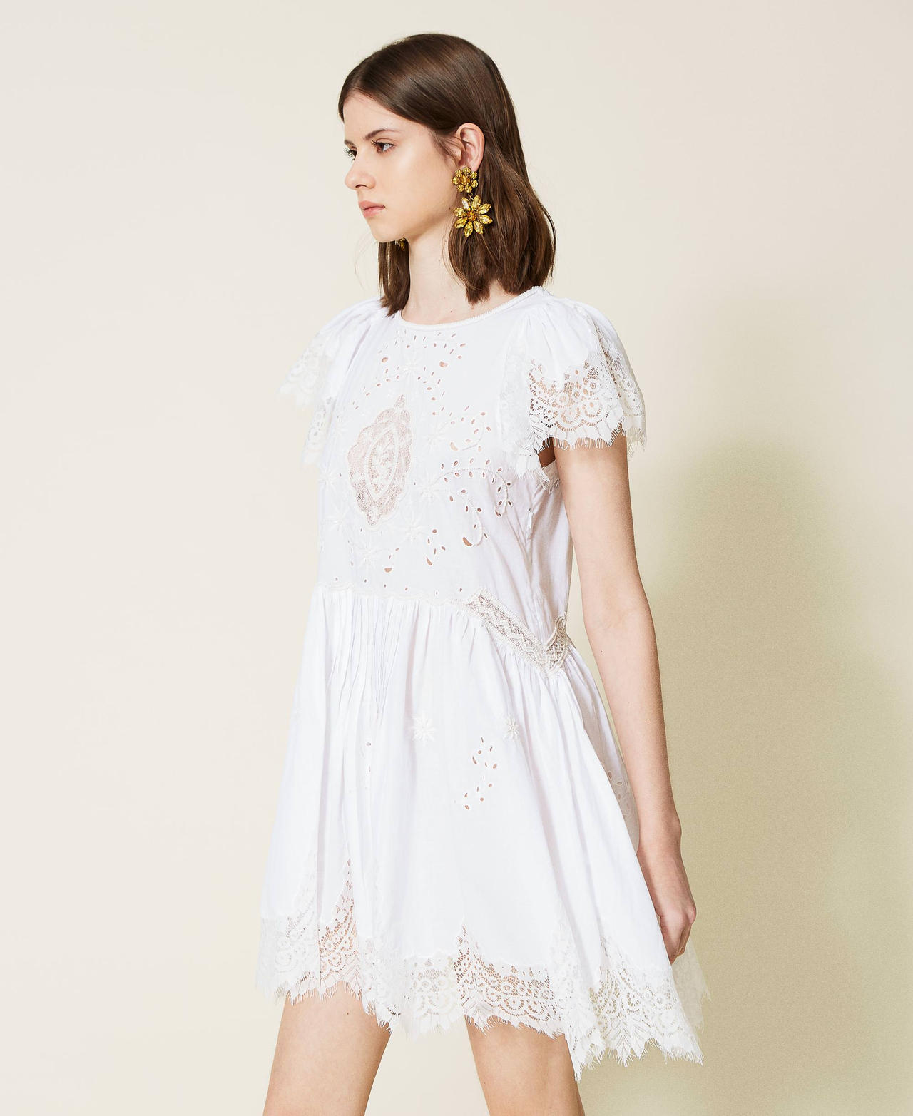 Hand-embroidered dress with inlaid lace