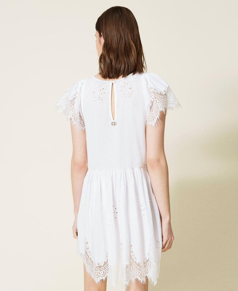 Hand-embroidered dress with inlaid lace