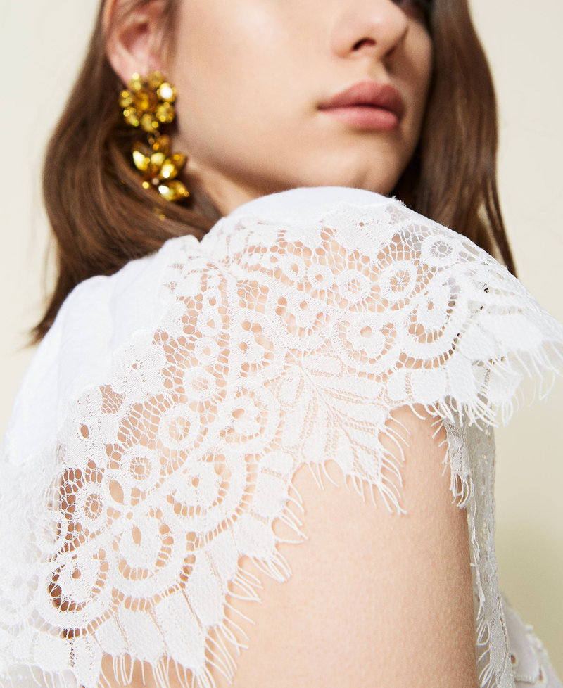 Hand-embroidered dress with inlaid lace