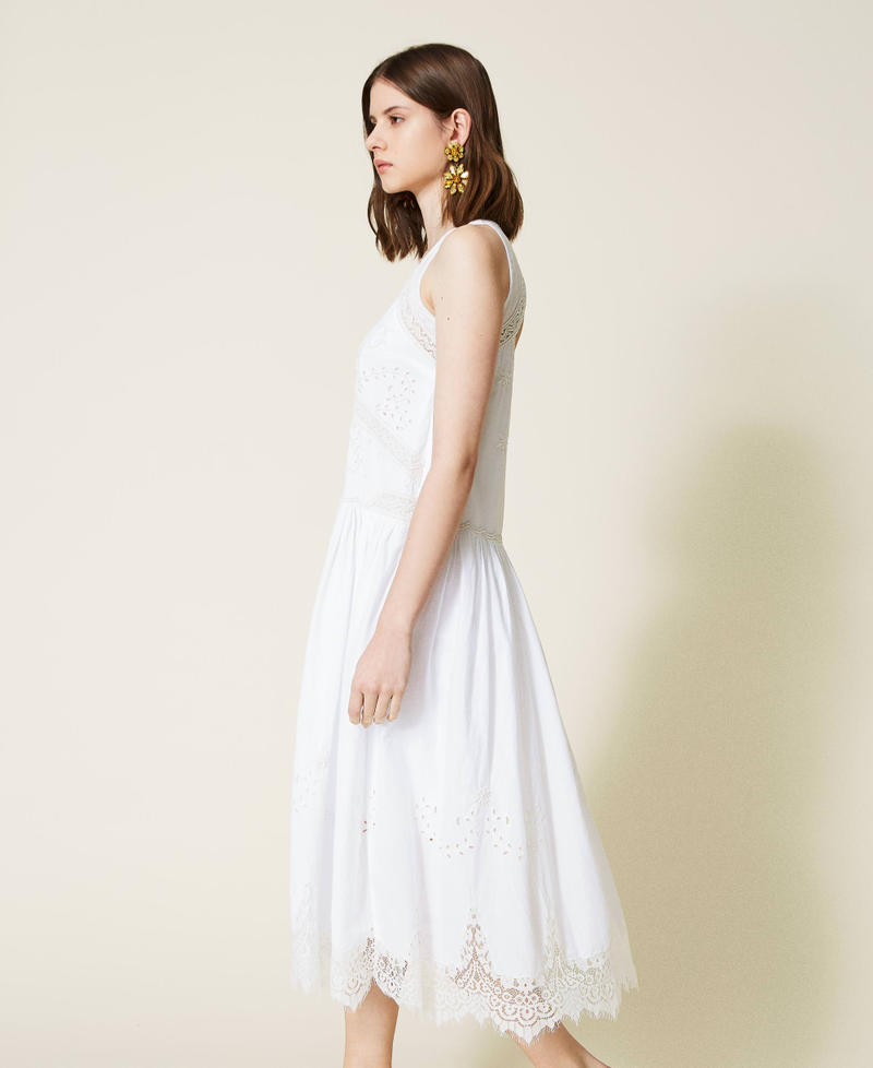 Hand-embroidered midi dress with lace