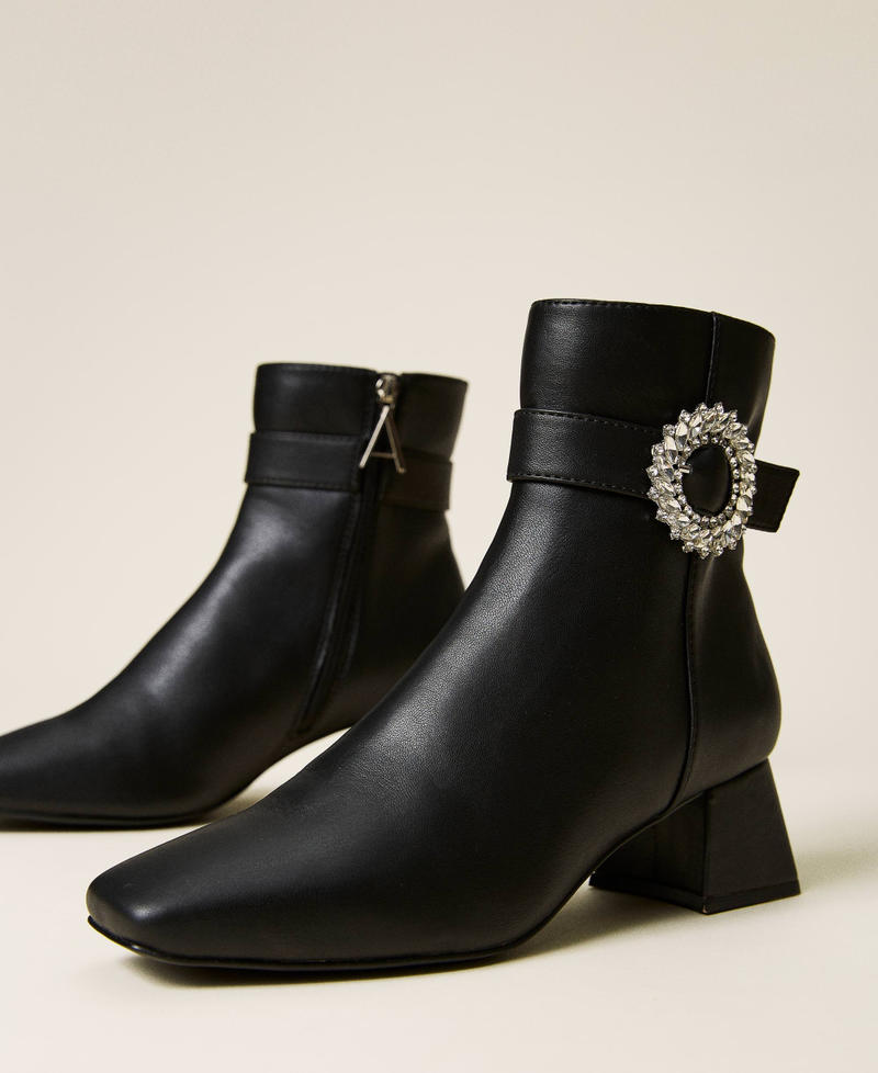 Ankle boots with strap and jewel buckle