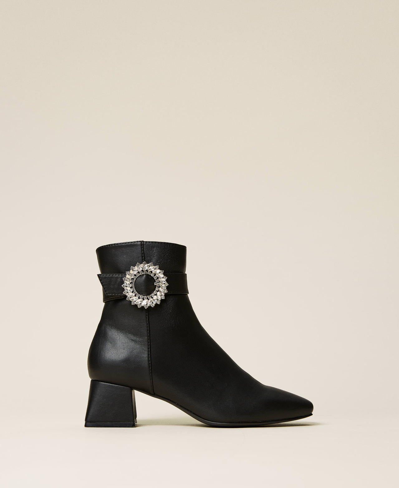 Ankle boots with strap and jewel buckle