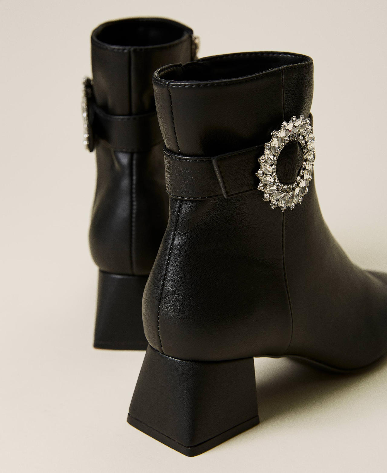 Ankle boots with strap and jewel buckle