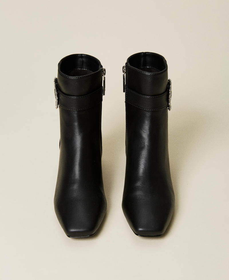 Ankle boots with strap and jewel buckle