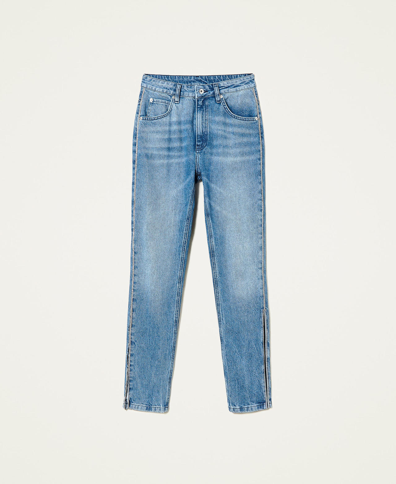 Jeans slim fit con strass e spacchi