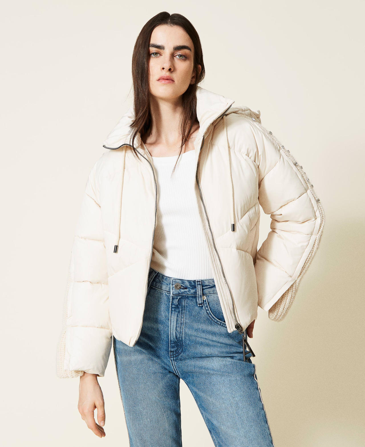 Puffer jacket with embroidered knit inserts